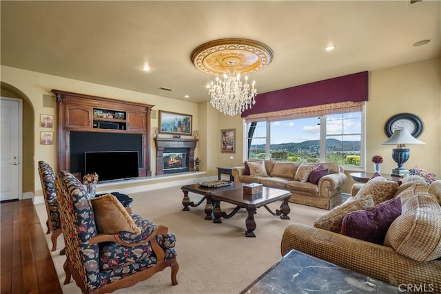 living room with wood-type flooring and a notable chandelier