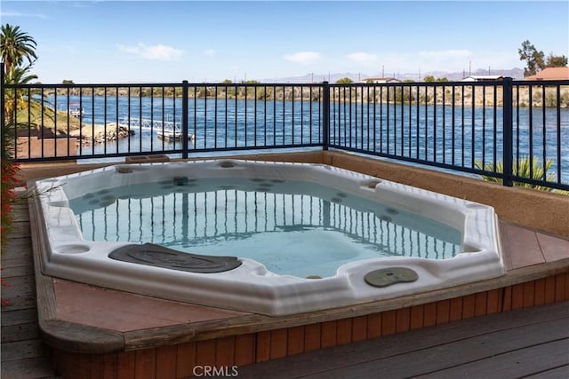 view of swimming pool with a water view