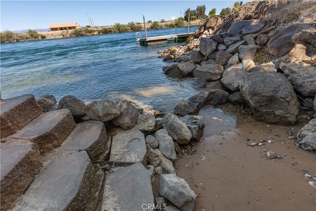 view of water feature with a dock