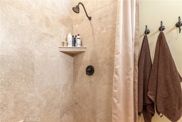 bathroom featuring curtained shower