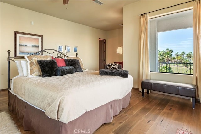 bedroom with ceiling fan and hardwood / wood-style floors