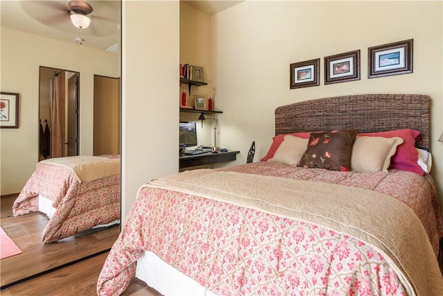 bedroom featuring hardwood / wood-style flooring and ceiling fan