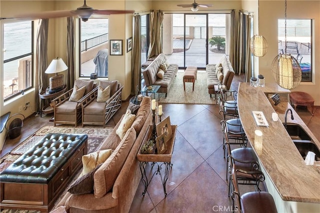 interior space with ceiling fan