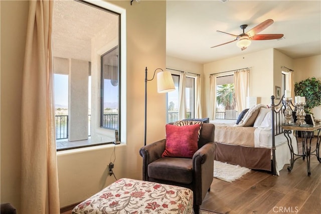 bedroom with hardwood / wood-style floors and ceiling fan
