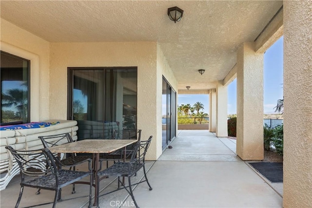 view of patio / terrace featuring an outdoor fire pit