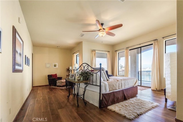 bedroom featuring access to outside, ceiling fan, and dark hardwood / wood-style floors