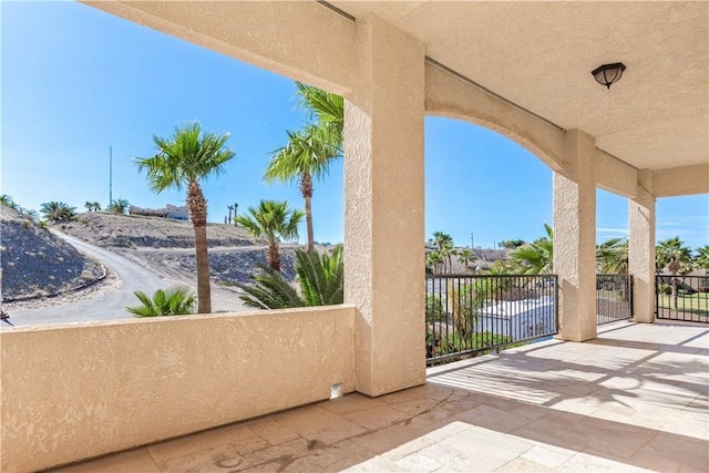 view of patio featuring a balcony