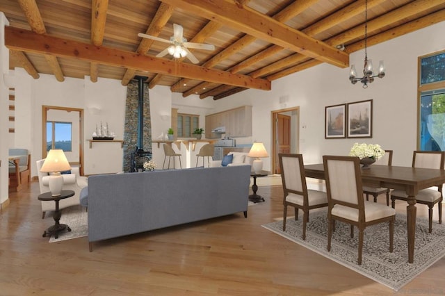 dining space with ceiling fan with notable chandelier, wood ceiling, hardwood / wood-style flooring, and beam ceiling