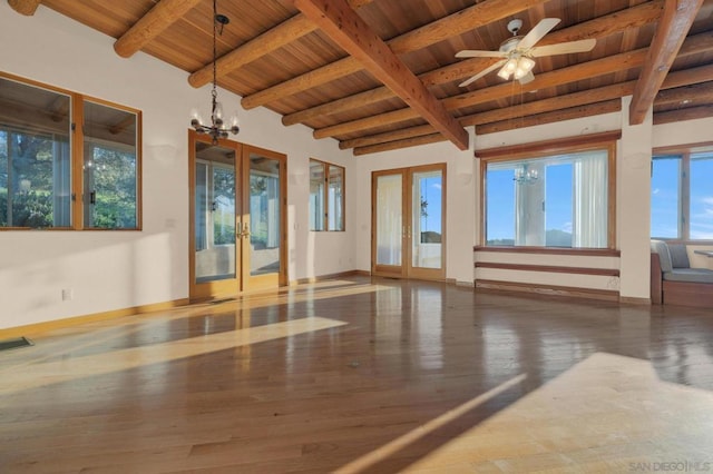 exercise area with wood ceiling, french doors, ceiling fan with notable chandelier, and hardwood / wood-style flooring