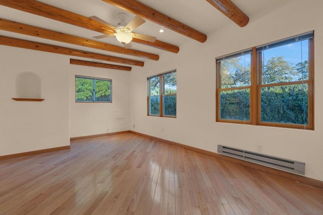 empty room featuring a baseboard heating unit, ceiling fan, light wood-type flooring, and beam ceiling