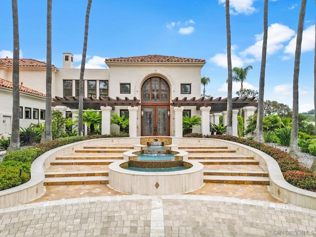 view of home's community featuring a pergola