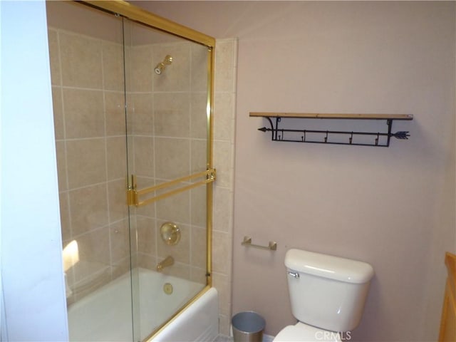 bathroom with toilet and enclosed tub / shower combo