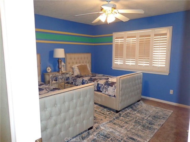 bedroom with ceiling fan and carpet floors