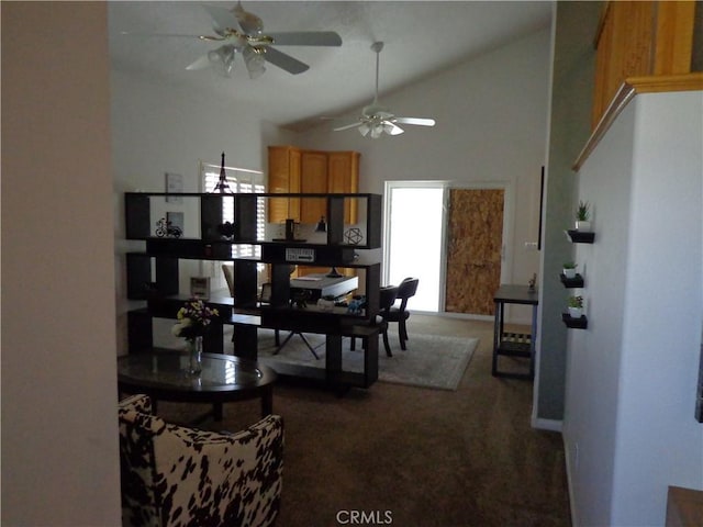 carpeted dining area featuring high vaulted ceiling