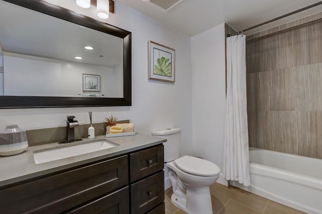 full bathroom with tile patterned flooring, toilet, vanity, and shower / tub combo with curtain