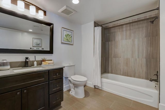 full bathroom with tile patterned floors, toilet, vanity, and shower / bath combo