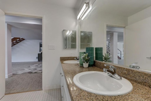 bathroom featuring tile patterned flooring and vanity