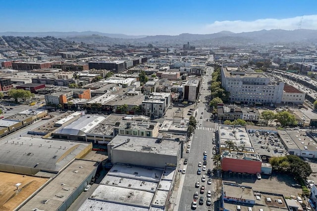 birds eye view of property with a mountain view