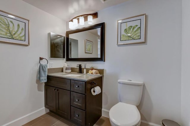 bathroom with toilet and vanity