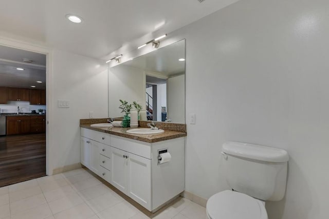 bathroom featuring toilet and vanity