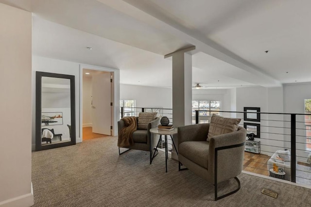 carpeted living room featuring ceiling fan