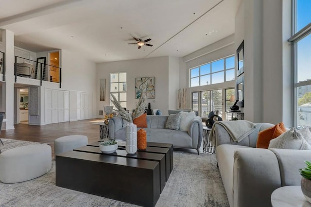 living room with ceiling fan, a wealth of natural light, and hardwood / wood-style flooring