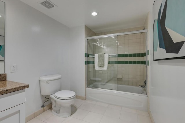 full bathroom featuring enclosed tub / shower combo, vanity, toilet, and tile patterned flooring