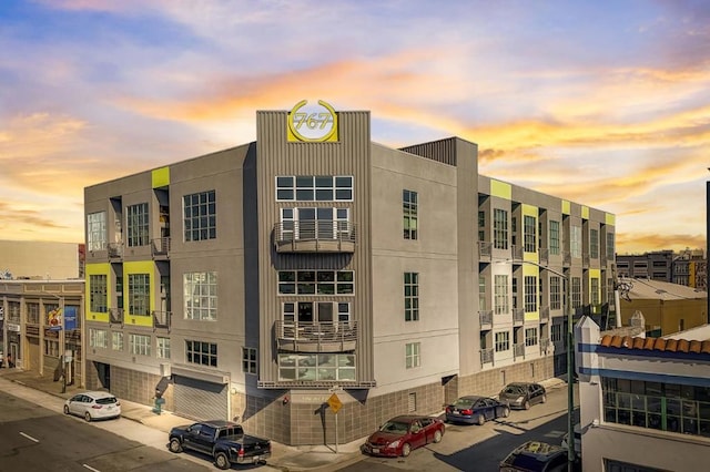 view of outdoor building at dusk