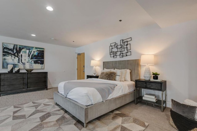 bedroom featuring light colored carpet