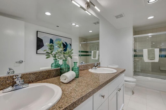 full bathroom with toilet, combined bath / shower with glass door, tile patterned flooring, and vanity