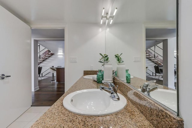 bathroom featuring tile patterned flooring and vanity