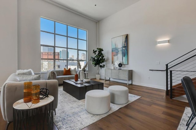 living room with dark hardwood / wood-style flooring