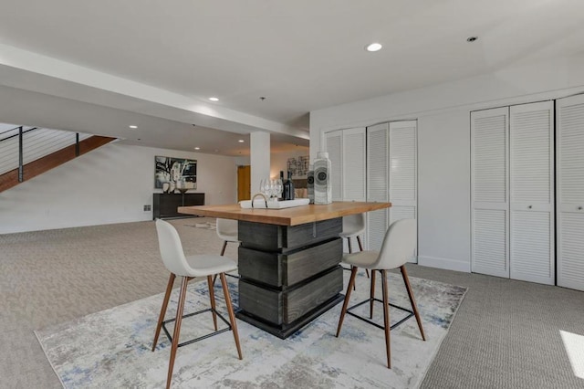 dining space with light carpet