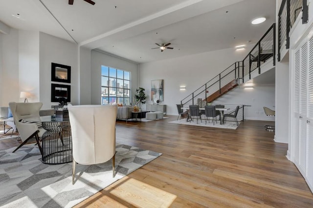 living room featuring ceiling fan and hardwood / wood-style floors