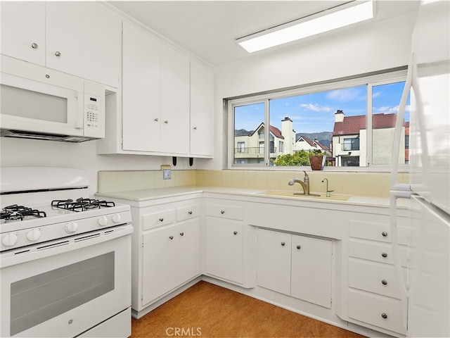 1901 Peyton Ave Unit T, Burbank, CA 91504 - kitchen featuring white appliances, light hardwood / wood-style floors, sink, and white cabinetry