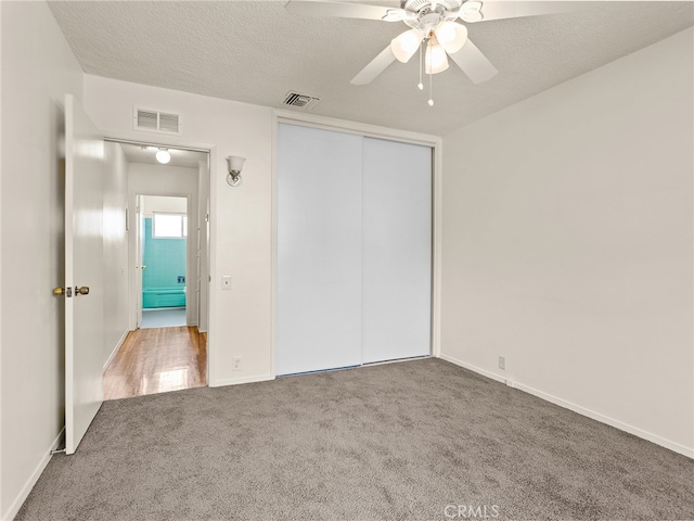 1901 Peyton Ave Unit T, Burbank, CA 91504 - unfurnished bedroom with a closet, ceiling fan, carpet floors, and a textured ceiling