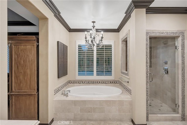 bathroom featuring a chandelier, ornamental molding, and separate shower and tub