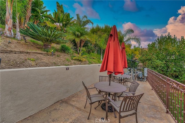 view of patio terrace at dusk