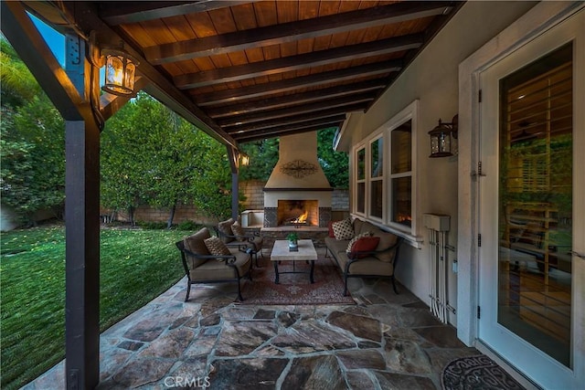 view of patio / terrace featuring exterior fireplace