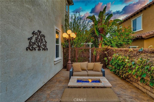 patio terrace at dusk with outdoor lounge area