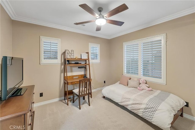 carpeted bedroom with ceiling fan and crown molding