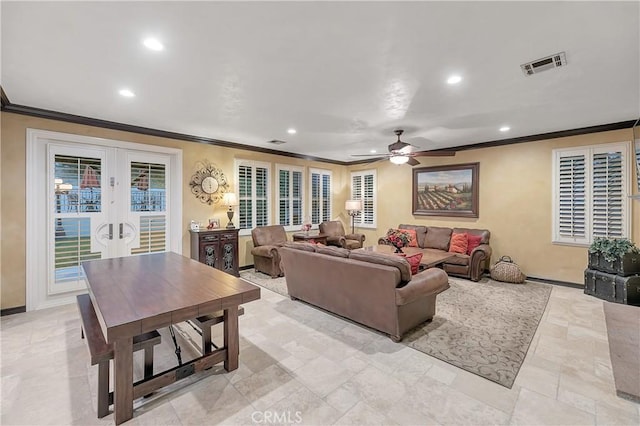 living room with ceiling fan, ornamental molding, and french doors