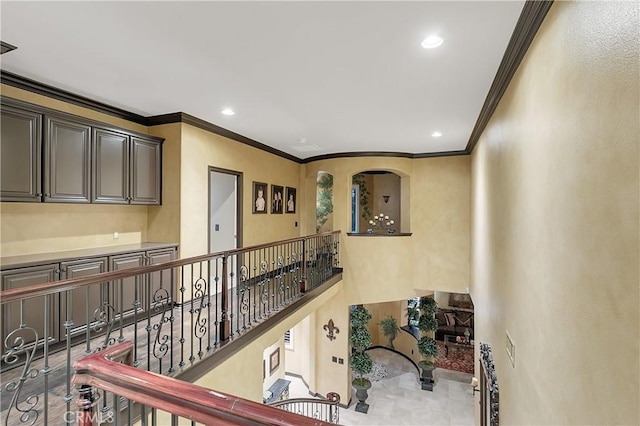 hallway featuring ornamental molding