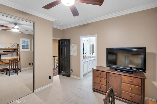 office featuring light carpet, ceiling fan, and ornamental molding