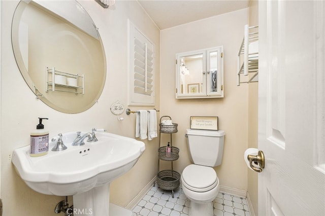 bathroom featuring sink and toilet