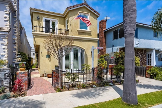 view of front of home with a balcony