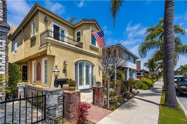 mediterranean / spanish home featuring a balcony