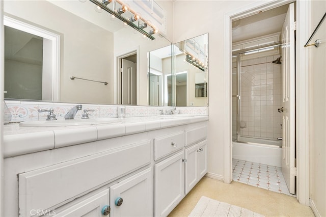 bathroom with enclosed tub / shower combo and vanity