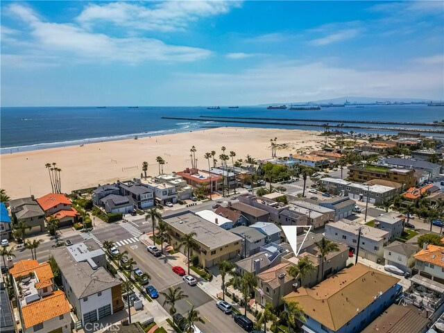 aerial view featuring a view of the beach and a water view