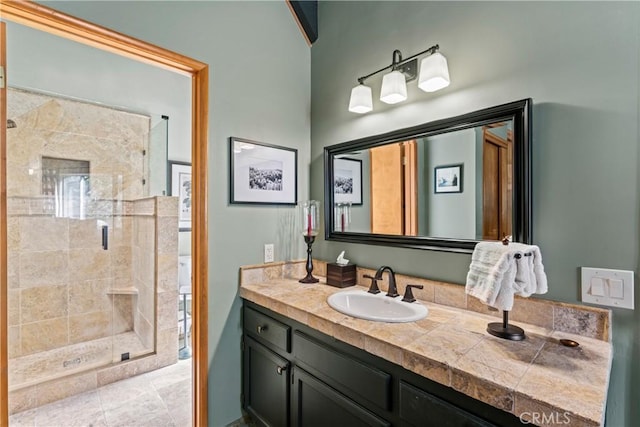 bathroom featuring an enclosed shower and vanity